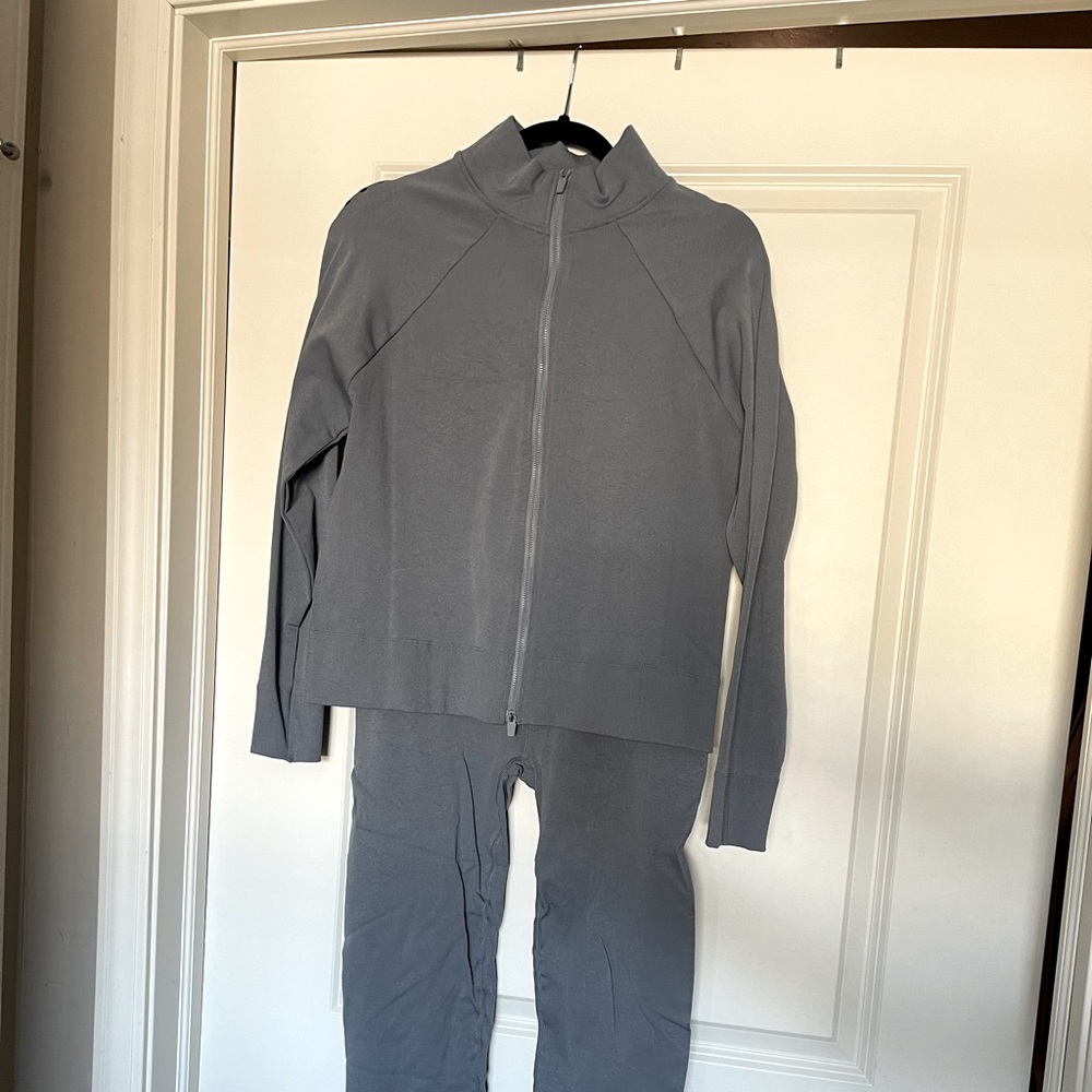 Light blue athletic track suit